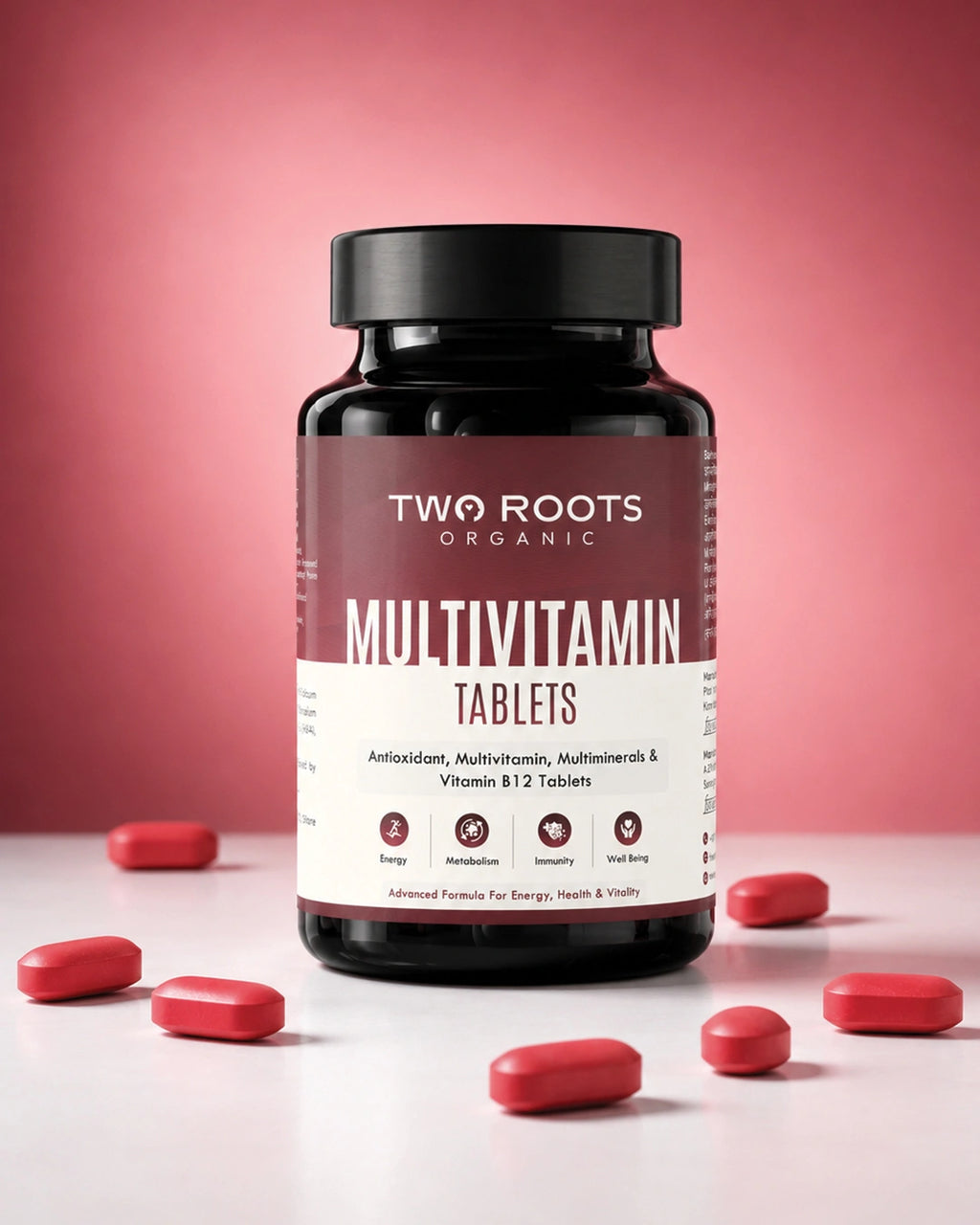 Multivitamin bottle labeled 'Two Roots' with red tablets on a pink background