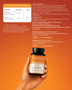 Bottle of 'Two Roots' Vitamin B12 & D3 tablets held in a hand against an orange background with product details.